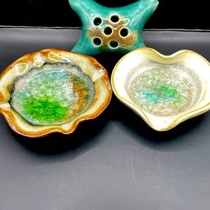 Two pottery trinket dishes and a pottery flower frog.